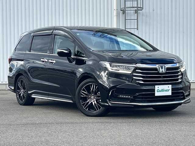 ホンダ オデッセイ ハイブリッド e:HEVアブソルート EX 愛媛県 2020(令2)年 5.1万km プレミアムスパークルブラックパール 純正ナビ/フリップダウンモニター/全方位カメラ/両側パワースライドドア/ブラインドスポットモニター/ビルトイン2.0ETC/ドライブレコーダー前後/衝突軽減システム/電動リアゲート/コーナーセンサー前後/オットマン/クルーズコントロール追従あり/合皮シート/シートヒーター/オートライトLED/レーンキープアシスト/ウォークスルー/パワーシート/フォグランプ
