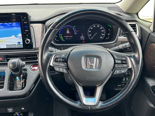 ホンダ オデッセイ ハイブリッド e:HEVアブソルート EX 愛媛県 2020(令2)年 5.1万km プレミアムスパークルブラックパール 純正ナビ/フリップダウンモニター/全方位カメラ/両側パワースライドドア/ブラインドスポットモニター/ビルトイン2.0ETC/ドライブレコーダー前後/衝突軽減システム/電動リアゲート/コーナーセンサー前後/オットマン/クルーズコントロール追従あり/合皮シート/シートヒーター/オートライトLED/レーンキープアシスト/ウォークスルー/パワーシート/フォグランプ