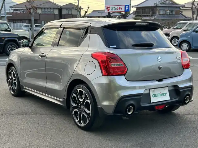 スズキ スイフト スポーツ 愛媛県 2023(令5)年 5万km プレミアムシルバーメタリック 6速MT/純正8型ナビ（Bluetooth/フルセグTV）/アラウンドビューモニター/アダプティブクルーズコントロール/ETC/前後ドライブレコーダー/純正フロアマット/純正17インチアルミホイール/ブラインドスポットモニター/スズキセーフティサポート/ステアリングリモコン/トノカバー/前後コーナーセンサー/LEDヘッドライト/スマートキー