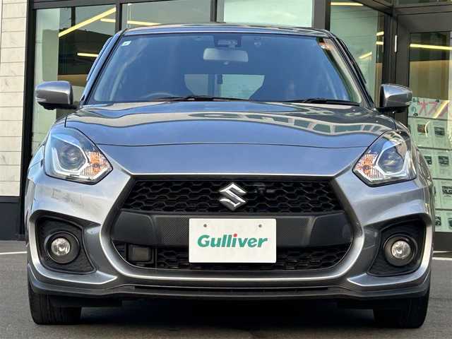 スズキ スイフト スポーツ 愛媛県 2023(令5)年 5万km プレミアムシルバーメタリック 6速MT/純正8型ナビ（Bluetooth/フルセグTV）/アラウンドビューモニター/アダプティブクルーズコントロール/ETC/前後ドライブレコーダー/純正フロアマット/純正17インチアルミホイール/ブラインドスポットモニター/スズキセーフティサポート/ステアリングリモコン/トノカバー/前後コーナーセンサー/LEDヘッドライト/スマートキー