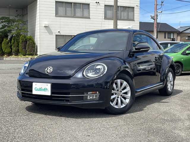 フォルクスワーゲン ザ・ビートル デザイン 福井県 2013(平25)年 6.7万km ディープブラックパールエフェクト 登録時走行距離66768km/社外メモリナビゲーション/（CD/DVD/BT）/バックカメラ/ターボ/HIDヘッドライト/フォグランプ/ミラーヒーター/キーレスキー /純正16インチアルミホイール/電動格納ミラー/保証書/取扱説明書