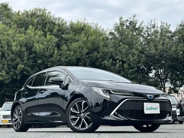 トヨタ カローラ スポーツ ハイブリッドG Z 東京都 2021(令3)年 2.9万km アティチュードブラックマイカ ワンオーナー/R4/5/6/7年分ディーラー整備記録簿あり/赤本革×ウルトラスエードコンビシート/前席シートヒーター/9インチディスプレイオーディオ/バックカメラ/純正ビルトインETC2.0/前後ドライブレコーダー(DRV-MR450)/純正18インチアルミホイール/ステアリングヒーター/Bi-BeamLEDヘッドランプ/インテリジェントクリアランスソナー/パーキングサポートブレーキ/ブラインドスポットモニター/Toyota Safety Sense