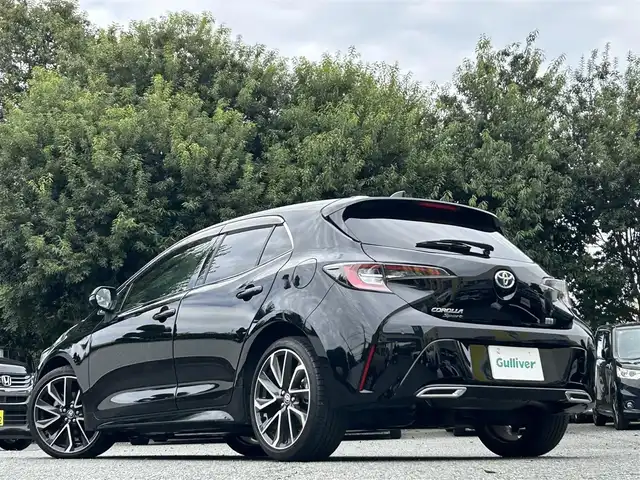 トヨタ カローラ スポーツ ハイブリッドG Z 東京都 2021(令3)年 2.9万km アティチュードブラックマイカ ワンオーナー/R4/5/6/7年分ディーラー整備記録簿あり/赤本革×ウルトラスエードコンビシート/前席シートヒーター/9インチディスプレイオーディオ/バックカメラ/純正ビルトインETC2.0/前後ドライブレコーダー(DRV-MR450)/純正18インチアルミホイール/ステアリングヒーター/Bi-BeamLEDヘッドランプ/インテリジェントクリアランスソナー/パーキングサポートブレーキ/ブラインドスポットモニター/Toyota Safety Sense