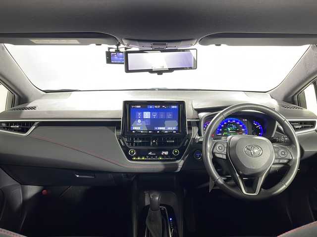 トヨタ カローラ スポーツ ハイブリッドG Z 沖縄県 2019(令1)年 5.4万km ホワイトパールクリスタルシャイン 禁煙車/ワンオーナー/ＴＲＤフルエアロ/トヨタセーフティーセンス/・プリクラクションセーフティー/・車線逸脱抑制機能/純正9インチナビ/・CD／DVD/Bluetooth／フルセグTV/ブラインドスポットモニター/前後ドライブレコーダー/前後コーナーセンサー/純正アルミ/デジタルインナーミラー/ＥＴＣ/スペアキー1本/取扱説明書/保証書