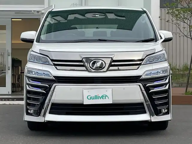 トヨタ ヴェルファイア ZG 道央・札幌 2018(平30)年 0.5万km ホワイトパールクリスタルシャイン ・４WD/・ワンオーナー/・衝突軽減ブレーキ/・寒冷地仕様/・両側パワースライドドア/・ローダウン/・ハーフレザーシート/・パワーシート/・ブラインドスポットモニター/・デジタルインナーミラー/・純正ナビ/　CD＆DVD＆BT＆TV/・バックカメラ/・フリップダウンモニター/・パーキングアシスト/・レーダークルーズコントロール/・シートヒーター/・アイドリングストップ/・コーナーセンサー/・レーンキープアシスト/・純正エンジンスターター/・前後ドライブレコーダー/・パワーバックドア/・オートエアコン/・オートライト/・オートリトラミラー/・レインセンサーワイパー/・ワイパー熱線/・ステアリングヒーター/・プッシュスタート/・スマートキー/・MT付きAT/・ビルトインETC/・社外AW＆冬タイヤ積込/・純正サスペンション積込/・JBLプレミアムサウンド/・純正フロアマット/・ウィンカーミラー/・フォグライト/・ドアバイザー/・スペアキー