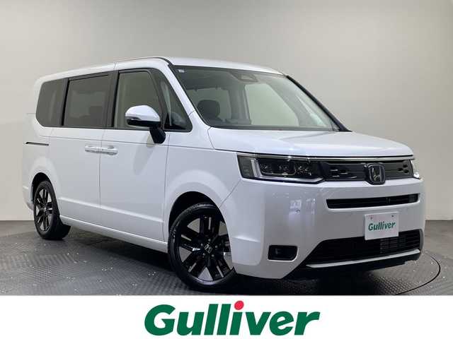 ホンダ ステップワゴン eHEV エアー EX 愛媛県 2025(令7)年 0.1千km プラチナホワイトパール 登録済未使用車/11.4インチナビHonda CONNECTナビ /フルセグ/Bluetooth/バックカメラ/衝突被害軽減ブレーキ/レーンアシスト/アダクティブクルーズコントロール/両側電動スライドドア/電動リアゲート/ＤＮ席シートヒーター/ＢＳＭ/前後コーナーセンサー/オットマン/禁煙車