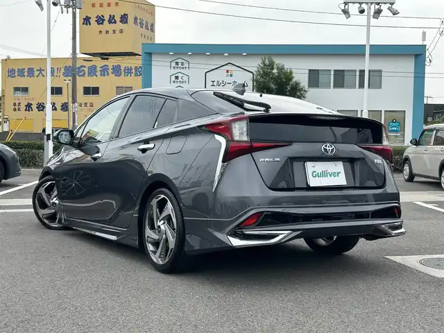 トヨタ プリウス A プレミアム　ツーリングセレ 愛媛県 2019(令1)年 4.2万km グレーメタリック ディーラーOP純正ナビ/CD/DVD/TV/BT/HDMI/ETC/バックカメラ/ブラインドスポットモニター/衝突軽減システム/ヘッドアップディスプレイ/レザーシート/D席パワーシート/D+N席シートヒーター・クーラー/クルーズコントロール/LEDヘッドライト/フォグランプ/モデリスタエアロパーツ（フロント・サイド・リア）/モデリスタアルミホイール/置くだけ充電
