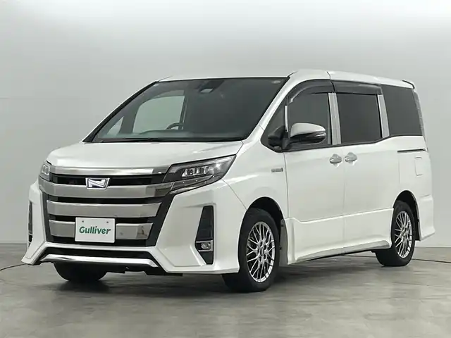 トヨタ ノア ハイブリッド Si ダブルバイビー 福島県 2018(平30)年 10万km ホワイトパールクリスタルシャイン トヨタセーフティセンス/純正9インチナビ/・フルセグ/TV/CD/DVD/BT/FM/AM/バックカメラ/両側パワースライドドア/LEDヘッドライト/・フォグライト/シートヒーター/社外BBSアルミホイール付きサマータイヤ/ステアリングスイッチ/ドラレコ前後/純正ビルドインETC2.0/プッシュスタート/・スマートキー