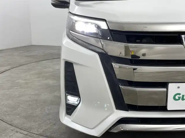 トヨタ ノア ハイブリッド Si ダブルバイビー 福島県 2018(平30)年 10万km ホワイトパールクリスタルシャイン トヨタセーフティセンス/純正9インチナビ/・フルセグ/TV/CD/DVD/BT/FM/AM/バックカメラ/両側パワースライドドア/LEDヘッドライト/・フォグライト/シートヒーター/社外BBSアルミホイール付きサマータイヤ/ステアリングスイッチ/ドラレコ前後/純正ビルドインETC2.0/プッシュスタート/・スマートキー