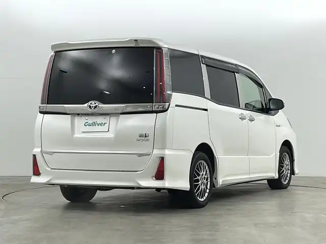 トヨタ ノア ハイブリッド Si ダブルバイビー 福島県 2018(平30)年 10万km ホワイトパールクリスタルシャイン トヨタセーフティセンス/純正9インチナビ/・フルセグ/TV/CD/DVD/BT/FM/AM/バックカメラ/両側パワースライドドア/LEDヘッドライト/・フォグライト/シートヒーター/社外BBSアルミホイール付きサマータイヤ/ステアリングスイッチ/ドラレコ前後/純正ビルドインETC2.0/プッシュスタート/・スマートキー