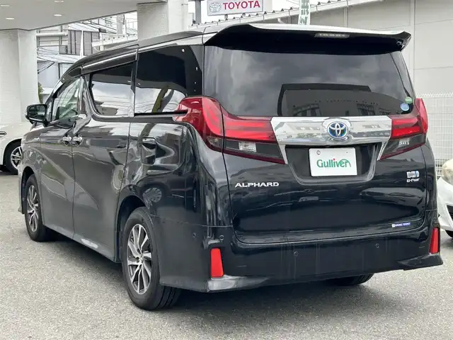 トヨタ アルファードハイブリット SR 福岡県 2016(平28)年 6.4万km ブラック ワンオーナー/純正ナビ（AM/FM/BT/CD/DVD/フルセグTV）/JBLプレミアムサウンド/クルーズコントロール/バックカメラ/前席パワーシート（運転席メモリ付）/オットマン（助手席、2列目）/インテリジェントクリアランスソナー/両側パワースライドドア/ビルトインETC/USB入力端子/リアエアコン/ドアバイザー/オートライト/フロアマット/純正17インチアルミホイール/プッシュスタート/横滑り防止装置/取扱説明書/保証書