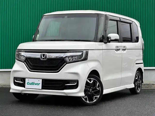 ホンダ Ｎ ＢＯＸ カスタム G L ターボ ホンダセンシング 宮城県 2018(平30)年 5.9万km プレミアムホワイトパールⅡ 禁煙車/登録時走行距離：58853km/ディーラーオプション純正8インチナビ/CD/DVD/フルセグTV/Bluetooth/バックカメラ/前方ドライブレコーダー/ビルトインETC/衝突被害軽減システム/後方センサー/横滑り防止装置/レーンキープアシスト/レーダークルーズコントロール/アイドリングストップ/LEDヘッドライト/フォグランプ/オートライト/ハーフレザーシート/パドルシフト/サンシェード/両側パワースライドドア/エンジンスタートボタン/スマートキー/純正フロアマット/純正15インチアルミホイール
