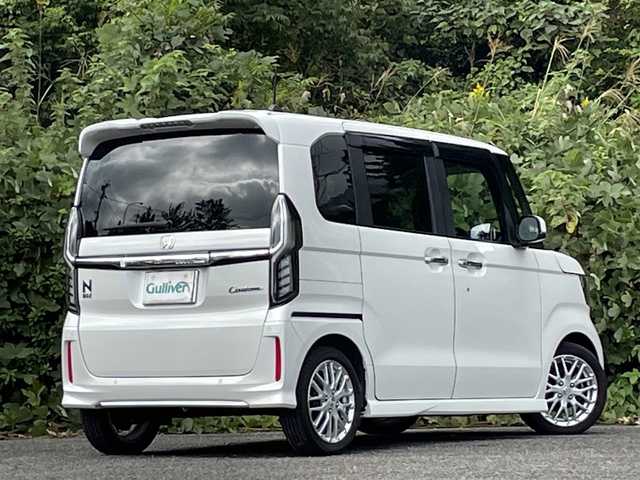 ホンダ Ｎ ＢＯＸ カスタム L ターボ 大分県 2022(令4)年 2.3万km プラチナホワイトパール オプションワンタッチスライドドア/両側パワースライドドア /ホンダセンシング/アダプティブクルーズコントロール/レーンキープアシスト/ハーフレザーシート/シートヒーター/純正メモリーナビ/バックカメラ/フルセグ/DVD/Bluetooth/前後ドライブレコーダー/大型ルーフコンソール/純正15インチアルミホイール/純正LEDヘッドライト/オートライトコントロール/ETC/ステアリングリモコン