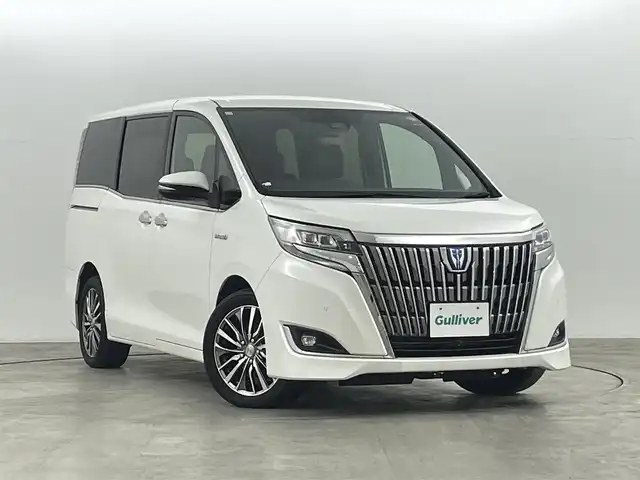 トヨタ エスクァイア ハイブリッド Gi プレミアムパッケージ 福島県 2019(平31)年 4.8万km ホワイトパールクリスタルシャイン クリアランスソナー/・衝突軽減/・オートハイビーム/純正フリップダウンモニター/純正9インチナビ/・BT/CD/DVD/AM/FM/バックカメラ/両側パワースライドドア/クルーズコントロール/LEDオートライト/・フォグライト/３列シート/・ハーフレザー/・ウォークスルー/・シートヒーター/・エアーシート/社外レオニスアルミホイール付きサマータイヤ/ETC/革ステアリング/・ステアリングリモコン/・ステアリングヒーター/純正フロアマット/純正ドアバイザー/アイドリングストップ/プッシュスタート/・スマートキー