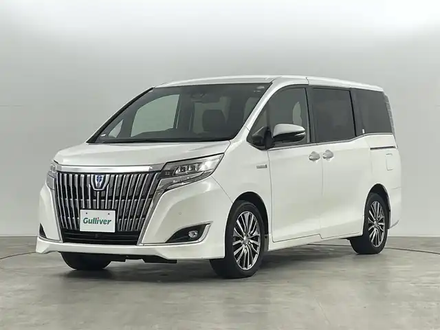 トヨタ エスクァイア ハイブリッド Gi プレミアムパッケージ 福島県 2019(平31)年 4.8万km ホワイトパールクリスタルシャイン クリアランスソナー/・衝突軽減/・オートハイビーム/純正フリップダウンモニター/純正9インチナビ/・BT/CD/DVD/AM/FM/バックカメラ/両側パワースライドドア/クルーズコントロール/LEDオートライト/・フォグライト/３列シート/・ハーフレザー/・ウォークスルー/・シートヒーター/・エアーシート/社外レオニスアルミホイール付きサマータイヤ/ETC/革ステアリング/・ステアリングリモコン/・ステアリングヒーター/純正フロアマット/純正ドアバイザー/アイドリングストップ/プッシュスタート/・スマートキー