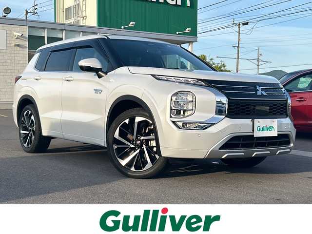 三菱 アウトランダー ＰＨＥＶ P 香川県 2022(令4)年 1.9万km ホワイトダイヤモンド 〇純正ナビ/〇フルセグＴＶ/〇パワーバックドア/〇マルチアラウンドモニター/〇ｅアシスト/・衝突被害軽減ブレーキ/・車線逸脱警報/〇マイパイロット/・レーダークルーズコントロール/〇LEDヘッドランプ/〇オートライト/〇純正20インチアルミ/〇ヘッドアップディスプレイ/〇革巻きステアリング/〇ステアリングヒーター/パドルシフト/〇シートヒーター/〇キーレスオペレーション/〇禁煙車
