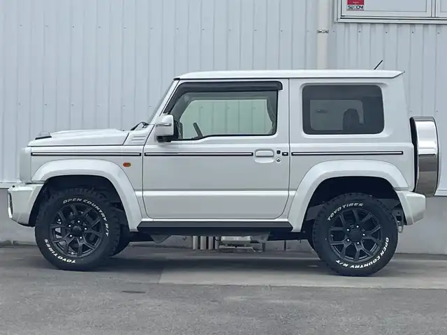 スズキ ジムニー シエラ JC 愛媛県 2024(令6)年 0.5万km ピュアホワイトP DAMD littleG仕様/社外7インチSDナビ/　CD/Bluetooth/ワンセグTV/バックカメラ/ビルトインETC/革調シートカバー/社外16インチAW/前席シートヒーター/プッシュスタート/クルーズコントロール/革巻きステアリング/ステアリングスイッチ/オートライト/LEDヘッドライト/フロアマット