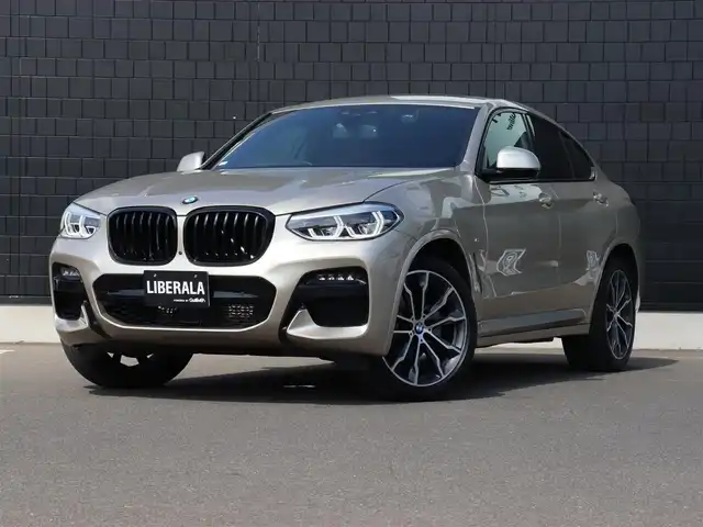 ＢＭＷ Ｘ４ xDrive 20d Mスポーツ 宮城県 2020(令2)年 2.6万km ゴールド ワンオーナー/純正ナビＴＶ/・フルセグ・ＢＴ・ＵＳＢ/パノラマサンルーフ/純正オプション２０インチＡＷ/ヘッドアップディスプレイ/パドルシフト/アダプティブクルーズコントロール/全方位カメラ/ブラインドスポットモニター/ブラウンレザーシート/全席シートヒーター/ミラー一体型ＥＴＣ/オートハイビーム/オートブレーキホールド/パワーバックドア/ダウンヒルアシスト/ワイヤレス充電/ドライブモードセレクト/ＬＥＤヘッドライト/前後フォグライト/カラーコード：Ｃ１Ｎ　サン・ストーン