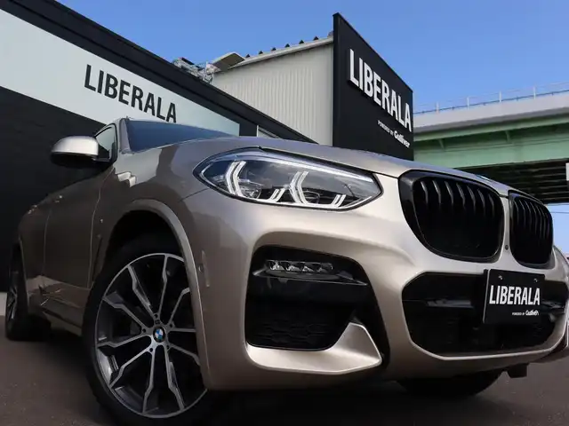 ＢＭＷ Ｘ４ xDrive 20d Mスポーツ 宮城県 2020(令2)年 2.6万km ゴールド ワンオーナー/純正ナビＴＶ/・フルセグ・ＢＴ・ＵＳＢ/パノラマサンルーフ/純正オプション２０インチＡＷ/ヘッドアップディスプレイ/パドルシフト/アダプティブクルーズコントロール/全方位カメラ/ブラインドスポットモニター/ブラウンレザーシート/全席シートヒーター/ミラー一体型ＥＴＣ/オートハイビーム/オートブレーキホールド/パワーバックドア/ダウンヒルアシスト/ワイヤレス充電/ドライブモードセレクト/ＬＥＤヘッドライト/前後フォグライト/カラーコード：Ｃ１Ｎ　サン・ストーン