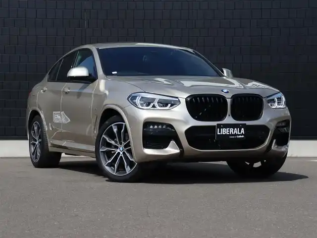 ＢＭＷ Ｘ４ xDrive 20d Mスポーツ 宮城県 2020(令2)年 2.6万km ゴールド ワンオーナー/純正ナビＴＶ/・フルセグ・ＢＴ・ＵＳＢ/パノラマサンルーフ/純正オプション２０インチＡＷ/ヘッドアップディスプレイ/パドルシフト/アダプティブクルーズコントロール/全方位カメラ/ブラインドスポットモニター/ブラウンレザーシート/全席シートヒーター/ミラー一体型ＥＴＣ/オートハイビーム/オートブレーキホールド/パワーバックドア/ダウンヒルアシスト/ワイヤレス充電/ドライブモードセレクト/ＬＥＤヘッドライト/前後フォグライト/カラーコード：Ｃ１Ｎ　サン・ストーン
