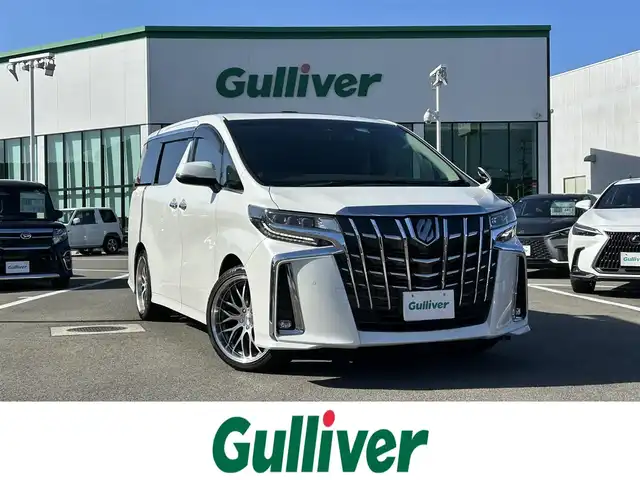トヨタ アルファード S Cパッケージ 愛媛県 2019(令1)年 2.9万km ホワイトパールクリスタルシャイン 登録時走行距離：28648km/メーカーOP純正ナビ/AM/FM/フルセグTV/DVD/CD/純正後席モニター/サンルーフ/前後ドラレコ/ETC/バックカメラ/デジタルミラー/追従クルコン/レーンキープアシスト/パーキングアシスト/衝突軽減システム/横滑り防止装置/両側パワスラ/電動リアゲート/シートメモリー/ハンドルヒーター/LEDヘッドライト/オートライト/エンジンスタートボタン/スマートキー/純正アルミホイール/純正フロアマット