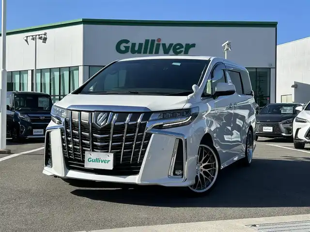 トヨタ アルファード S Cパッケージ 愛媛県 2019(令1)年 2.9万km ホワイトパールクリスタルシャイン 登録時走行距離：28648km/メーカーOP純正ナビ/AM/FM/フルセグTV/DVD/CD/純正後席モニター/サンルーフ/前後ドラレコ/ETC/バックカメラ/デジタルミラー/追従クルコン/レーンキープアシスト/パーキングアシスト/衝突軽減システム/横滑り防止装置/両側パワスラ/電動リアゲート/シートメモリー/ハンドルヒーター/LEDヘッドライト/オートライト/エンジンスタートボタン/スマートキー/純正アルミホイール/純正フロアマット
