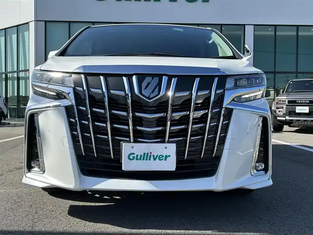 トヨタ アルファード S Cパッケージ 愛媛県 2019(令1)年 2.9万km ホワイトパールクリスタルシャイン 登録時走行距離：28648km/メーカーOP純正ナビ/AM/FM/フルセグTV/DVD/CD/純正後席モニター/サンルーフ/前後ドラレコ/ETC/バックカメラ/デジタルミラー/追従クルコン/レーンキープアシスト/パーキングアシスト/衝突軽減システム/横滑り防止装置/両側パワスラ/電動リアゲート/シートメモリー/ハンドルヒーター/LEDヘッドライト/オートライト/エンジンスタートボタン/スマートキー/純正アルミホイール/純正フロアマット