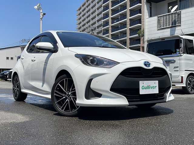 トヨタ ヤリス ハイブリッド X 宮崎県 2022(令4)年 1.7万km スーパーホワイトⅡ 純正ナビ/BT/USB/バックカメラ・ETC/トヨタセーフティセンス/レーンキープアシスト/パーキングサポートブレーキ/レーダークルーズコントロール/ドライブレコーダー/社外17インチアルミホイール/オートハイビーム/ウィンカーミラー/キーレスキー/純正フロアマット/ドアバイザー