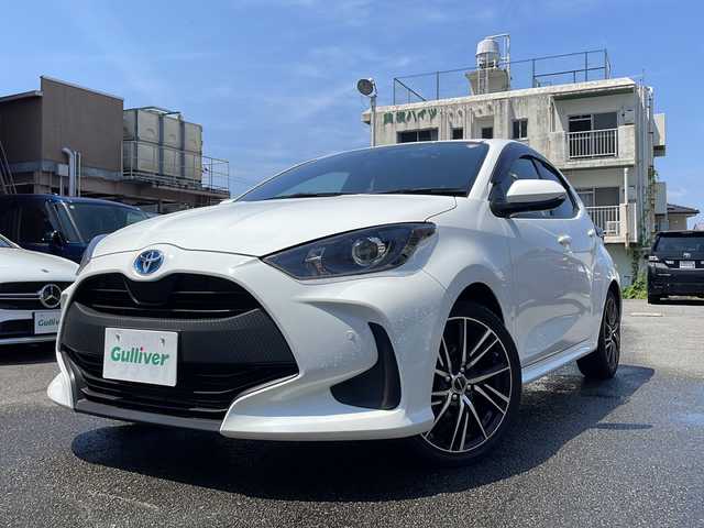 トヨタ ヤリス ハイブリッド X 宮崎県 2022(令4)年 1.7万km スーパーホワイトⅡ 純正ナビ/BT/USB/バックカメラ・ETC/トヨタセーフティセンス/レーンキープアシスト/パーキングサポートブレーキ/レーダークルーズコントロール/ドライブレコーダー/社外17インチアルミホイール/オートハイビーム/ウィンカーミラー/キーレスキー/純正フロアマット/ドアバイザー