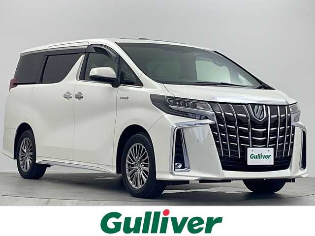 トヨタ アルファードハイブリット エグゼクティブ ラウンジ S 大阪府 2018(平30)年 1万km ラグジュアリーホワイトパールクリスタルシャインガラスフレーク 純正10.5インチメーカーナビ/【フルセグTV/Bluetooth/FM/AM/CD】/JBLプレミアムサウンド/13.3インチ純正後席モニター/ツインムーンルーフ/白革シート/前後シートヒーター/前後シートベンチレーション/ステアリングヒーター/全方位カメラ/ブラインドスポットモニター/ワイヤレス充電/両側パワースライドドア/パワーバックドア/トヨタセーフティセンス/・プリクラッシュセーフティー/・レーントレーシングアシスト/・レーンディパーチャーアラート/・レーダークルーズコントロール/・オートマチックハイビーム/保証書/点検記録簿
