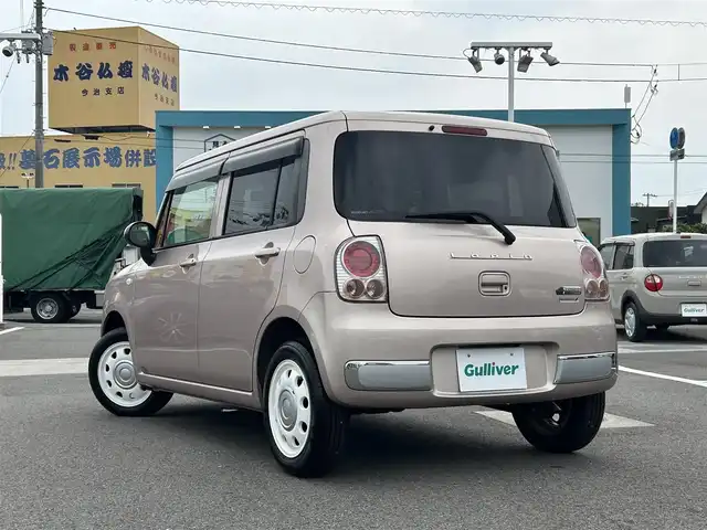 スズキ ラパン ショコラ G 愛媛県 2013(平25)年 3.3万km シャンパンピンクPM 登録時走行距離:32281km/スマートキー/純正フロアマット/純正アルミホイール/本革ステアリング/ツートンレザーシート/純正FM/CDプレーヤー/シガーソケット/ＡＣ/HIDヘッドライト/アイドリングストップ/盗難防止装置/ABS/パワステ/パワーウィンドウ/エアバッグ