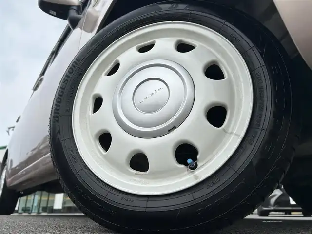 スズキ ラパン ショコラ G 愛媛県 2013(平25)年 3.3万km シャンパンピンクPM 登録時走行距離:32281km/スマートキー/純正フロアマット/純正アルミホイール/本革ステアリング/ツートンレザーシート/純正FM/CDプレーヤー/シガーソケット/ＡＣ/HIDヘッドライト/アイドリングストップ/盗難防止装置/ABS/パワステ/パワーウィンドウ/エアバッグ