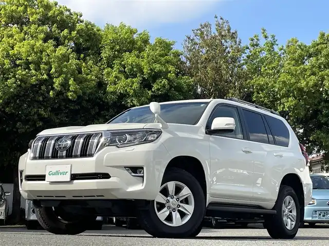 トヨタ ランドクルーザー プラド TX 東京都 2021(令3)年 3.1万km ホワイトパールクリスタルシャイン ワンオーナー/純正9インチSDナビ（NSZT-Y68T）/・Bluetoothオーディオ/USBオーディオ/・フルセグTV/DVD/スライド電動ムーンルーフ/バックカメラ/ルーフレール（ブラック）/Toyota Safety Sense/・プリクラッシュセーフティ/・レーンディパーチャーアラート/・オートライト/オートマチックハイビーム/・レーダークルーズコントロール/木目調（ライトブラウン）ステアリングホイール/寒冷地仕様/ビルトインETC2.0/取扱説明書/保証書