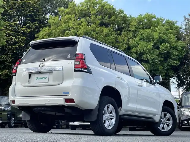 トヨタ ランドクルーザー プラド TX 東京都 2021(令3)年 3.1万km ホワイトパールクリスタルシャイン ワンオーナー/純正9インチSDナビ（NSZT-Y68T）/・Bluetoothオーディオ/USBオーディオ/・フルセグTV/DVD/スライド電動ムーンルーフ/バックカメラ/ルーフレール（ブラック）/Toyota Safety Sense/・プリクラッシュセーフティ/・レーンディパーチャーアラート/・オートライト/オートマチックハイビーム/・レーダークルーズコントロール/木目調（ライトブラウン）ステアリングホイール/寒冷地仕様/ビルトインETC2.0/取扱説明書/保証書