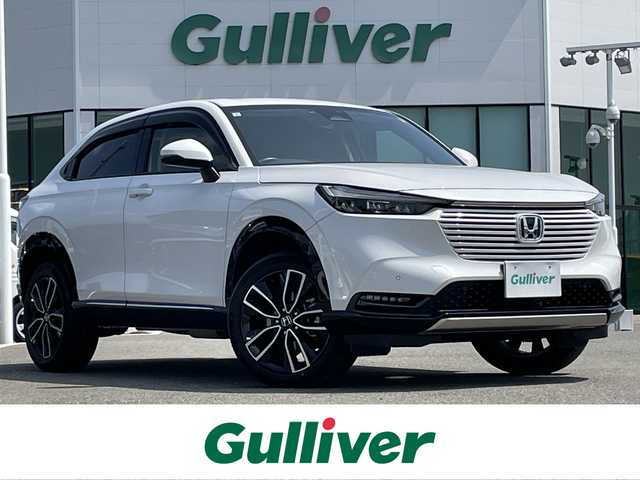 ホンダ ヴェゼル ハイブリッド e:HEV Z 佐賀県 2021(令3)年 4.5万km プラチナホワイトパール ワンオーナー/純正9インチSDナビゲーション/・フルセグTV/CD/DVD/SD/Bluetooth/バックカメラ/ETC/パワーテールゲート(予約クローズ機能付)/電子パーキングブレーキ/BRAKE HOLD機能/ハーフレザーシート/DN席シートヒーター/ISOFIX対応/パドルシフト/革巻きステアリング/ステアリングリモコン/純正18インチアルミホイール/純正LEDヘッドライト/オートマチックハイビーム/純正LEDフォグランプ/純正フロアマット/純正ドアバイザ―/フロントデアイサ―機能/新車保証書/取扱説明書/ホンダセンシング/・アダプティブクルーズコントロール/・路外逸脱抑制機能/・ブラインドスポットインフォメーション/・衝突軽減ブレーキ/・踏み間違い衝突軽減システム/・クリアランスソナー