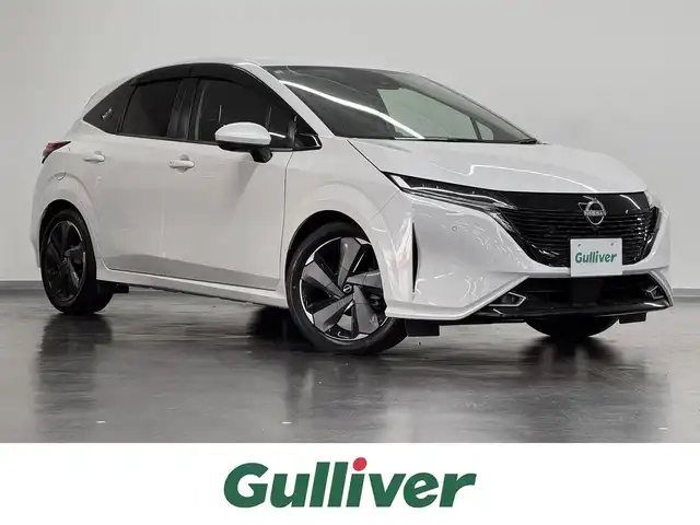 日産 オーラ G レザーエディション 三重県 2022(令4)年 6.1万km ピュアホワイトパール e-POWER/FF/フロアCVT/Nissan Connect対応 9インチナビ*/（AM/FM/TV/USB/iPod/Bluetooth/HDMI/CarPlay/AndroidAuto）/インテリジェント アラウンドビューモニター（移動物検知機能付）/BOSE パーソナルプラスサウンドシステム（8スピーカー）*/ETC2.0*/安全/・インテリジェント エマージェンシーブレーキ/・LDW（車線逸脱警報）、インテリジェント LI（車線逸脱防止支援）/・プロパイロット/・インテリジェント DA（ふらつき警報）/・速度標識表示、標識検知支援/・後側方車両検知警報システム（BSW）＋後側方衝突防止支援（BSI）＋後退時車両検知警報/・前後ソナー/・SOSコール/など/装備/・インテリジェント ルームミラー/・本革シート/・オートエアコン/・電動パーキングブレーキ＆ブレーキホールド/・ステアリングスイッチ/・オートライト/・アダプティブLEDヘッドライト/・プッシュスタート/・純正17inAW/・プッシュスタート/・スマートキーx2/など/*…メーカーOP