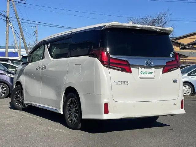 トヨタ アルファードハイブリット エグゼクティブ ラウンジ S 群馬県 2019(令1)年 1万km ホワイトパールクリスタルシャイン 法人ワンオーナー/４WD/純正メモリナビ、地デジ、Bluetooth、CD、DVD、MSV/JBLサウンドシステム/純正フリップダウンモニター/アラウンドビューモニター/デジタルインナーミラー/プリクラッシュセーフティ/レーダーブレーキサポート/ブラインドスポットモニター/ビルトインETC2.0/LEDヘッドライト/AFS/パワーバックドア/黒レザーシート/前席2列目オットマン、シートヒーター/　エアシート、パワーシート/ステアリングヒーター/ウインカーミラー/スマートキー×３/ドアバイザー/保証書、取説