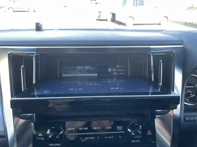 トヨタ アルファードハイブリット エグゼクティブ ラウンジ S 群馬県 2019(令1)年 1万km ホワイトパールクリスタルシャイン 法人ワンオーナー/４WD/純正メモリナビ、地デジ、Bluetooth、CD、DVD、MSV/JBLサウンドシステム/純正フリップダウンモニター/アラウンドビューモニター/デジタルインナーミラー/プリクラッシュセーフティ/レーダーブレーキサポート/ブラインドスポットモニター/ビルトインETC2.0/LEDヘッドライト/AFS/パワーバックドア/黒レザーシート/前席2列目オットマン、シートヒーター/　エアシート、パワーシート/ステアリングヒーター/ウインカーミラー/スマートキー×３/ドアバイザー/保証書、取説