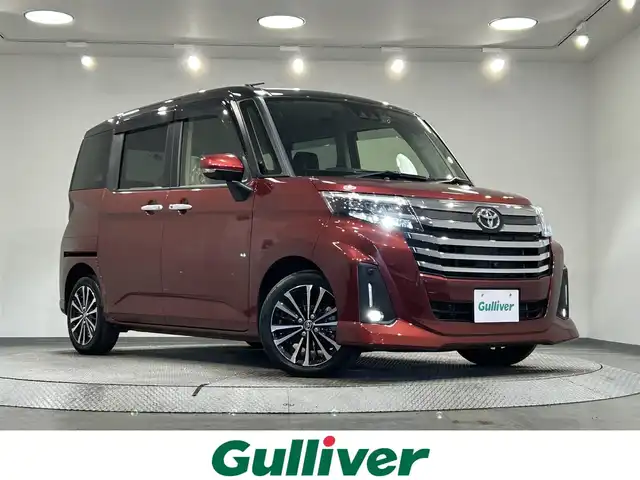 トヨタ ルーミー カスタムG－T 愛知県 2022(令4)年 1.6万km ブラックマイカメタリック/ファイアークォーツレッドメタリック 純正９インチナビ　/（Bluetooth/フルセグTV/CD・DVD再生）/衝突軽減ブレーキ　/両側電動スライドドア　/アラウンドビューモニター　/レーダークルーズコントロール　/ビルトインＥＴＣ　/前席シートヒーター　/ＬＥＤヘッドライト　/前後ドライブレコーダー　/コーナーセンサー