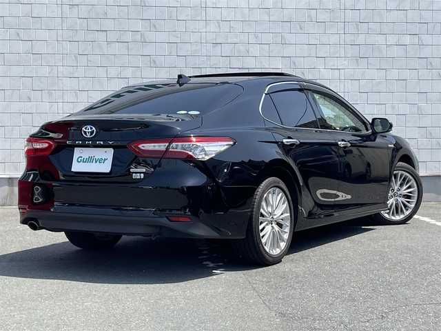 トヨタ カムリ G レザーパッケージ 愛知県 2019(令1)年 1.4万km アティチュードブラックマイカ ・純正メーカーナビ/・バックカメラ/・フルセグTV/・CD/DVD再生/・JBLサウンド/・ETC2.0/・Bluetooth/USB接続/・アダプティブクルーズコントロール/・MTモード付きAT/・パワーシート（D/N）/・シートヒーター（D/N）/・パノラマムーンルーフ/・純正フロアマット/・純正１８インチアルミホイール/・LEDヘッドライト/・オートマチックハイビーム/・コーナーセンサー/・横滑り防止装置/・プリクラッシュセーフティ/・レーンディパーチャーアラート（ステアリング制御機能付き）/・ブラインドスポットモニター/・電動パーキングブレーキ/・ブレーキホールド/・ドライブレコーダー（前）/・AC100V/・ステアリングアシステッドビークルスタビリティコントロール/・セカンダリーコリジョンブレーキ/・オートグライドコントロール