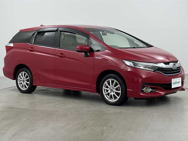 ホンダ シャトル ハイブリッド X 道央・札幌 2015(平27)年 7万km ミラノレッド ・４WD/・シティブレーキアクティブシステム/・クルーズコントロール/・横滑り防止装置/・パドルシフト/・車両接近通報装置/・チップアップリヤシート/・熱線入りフロントウインドウ/・純正ナビ/（CD/DVD/フルセグ/Bluetooth）/・ステアリングスイッチ/・バックカメラ/・ETC/・純正ドライブレコーダー/・オートエアコン/・オートライト/・LEDヘッドライト/・フォグランプ/・社外15インチアルミホイール