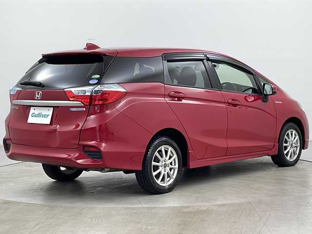 ホンダ シャトル ハイブリッド X 道央・札幌 2015(平27)年 7万km ミラノレッド ・４WD/・シティブレーキアクティブシステム/・クルーズコントロール/・横滑り防止装置/・パドルシフト/・車両接近通報装置/・チップアップリヤシート/・熱線入りフロントウインドウ/・純正ナビ/（CD/DVD/フルセグ/Bluetooth）/・ステアリングスイッチ/・バックカメラ/・ETC/・純正ドライブレコーダー/・オートエアコン/・オートライト/・LEDヘッドライト/・フォグランプ/・社外15インチアルミホイール