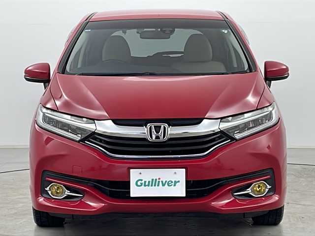 ホンダ シャトル ハイブリッド X 道央・札幌 2015(平27)年 7万km ミラノレッド ・４WD/・シティブレーキアクティブシステム/・クルーズコントロール/・横滑り防止装置/・パドルシフト/・車両接近通報装置/・チップアップリヤシート/・熱線入りフロントウインドウ/・純正ナビ/（CD/DVD/フルセグ/Bluetooth）/・ステアリングスイッチ/・バックカメラ/・ETC/・純正ドライブレコーダー/・オートエアコン/・オートライト/・LEDヘッドライト/・フォグランプ/・社外15インチアルミホイール