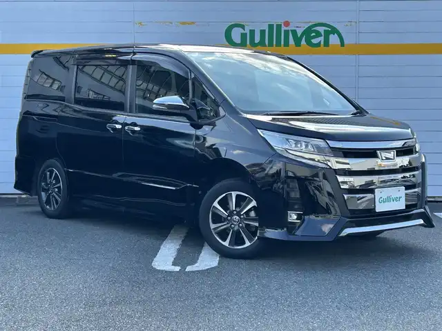 トヨタ ノア Si ダブルバイビーⅢ 埼玉県 2021(令3)年 2.9万km ブラック ワンオーナー/バックカメラ/アイドリングストップ/衝突被害軽減ブレーキ/レーンアシスト/横滑り防止装置/純正ディーラーナビ/クルーズコントロール/クリアランスソナー/フロアマット/オートライト/オートハイビーム/パーキングアシスト/ドライブレコーダー/ETC/USB接続端子/両側イージークローザードア/プッシュスタート/フルセグテレビ/Bluetooth接続/DVD再生/WAC/ABS/PW/PS/純正アルミホイール/ドアバイザー