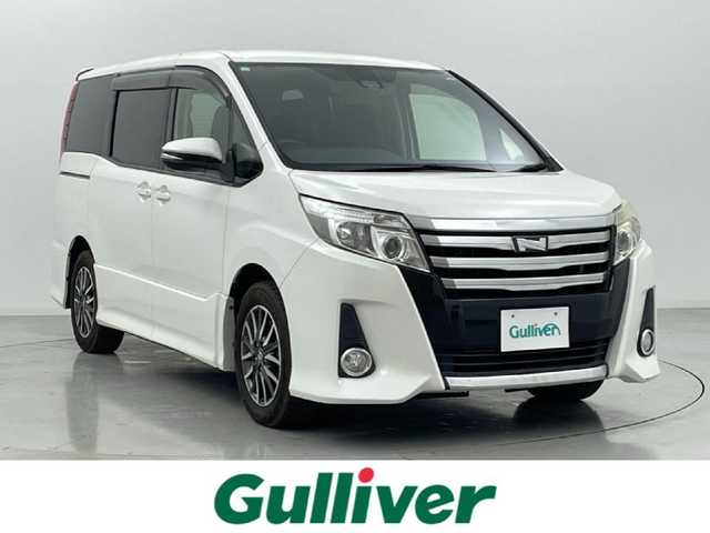 トヨタ ノア Si 熊本県 2016(平28)年 6万km ホワイトパールクリスタルシャイン 禁煙車　/純正ナビ（ＣＤ・ＤＶＤ・フルセグ・ＢＴ・ＳＤ）/バックカメラ　/社外前後ドライブレコーダー（ZDR025）　/社外フリップダウンモニター/ビルトインＥＴＣ　/両側パワースライドドア　/アイドリングストップ　/衝突軽減ブレーキ　/レーンキープアシスト/横滑り防止/純正フロアマット/純正16インチAW/オートライト/オートマチックハイビーム/LEDヘッドライト/フォグライト/スマートキー/プッシュスタート/スペアキー1本
