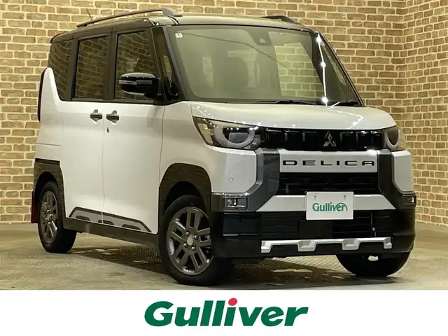 三菱 デリカミニ T プレミアム 岩手県 2024(令6)年 0.8万km アメジストブラック/シルキーホワイト ４WD/ターボ/ルーフレール/マッドフラップ/マルチアラウンドモニター/両側ハンズフリーオートスライドドア/デジタルルームミラー/リヤサーキュレーション/ヒルディセントコントロール/ヒルスタートアシスト/e-Assist/衝突被害軽減ブレーキシステム/路外逸脱防止支援機能/標識認識システム/先行車発進通知システム/踏み間違い衝突防止アシスト/マイパイロット/レーダークルーズコントロール/車線維持支援機能/コーナーセンサー/オートハイビーム/横滑り防止装置/アイドリングストップ/パドルシフト/リヤロールサンシェード/撥水シート生地/前席シートヒーター/ステアリングヒーター/ブレーキオートホールド/純正ディスプレイオーディオ/AppleCarPlay・AndroidAuto/純正１５インチアルミホイール