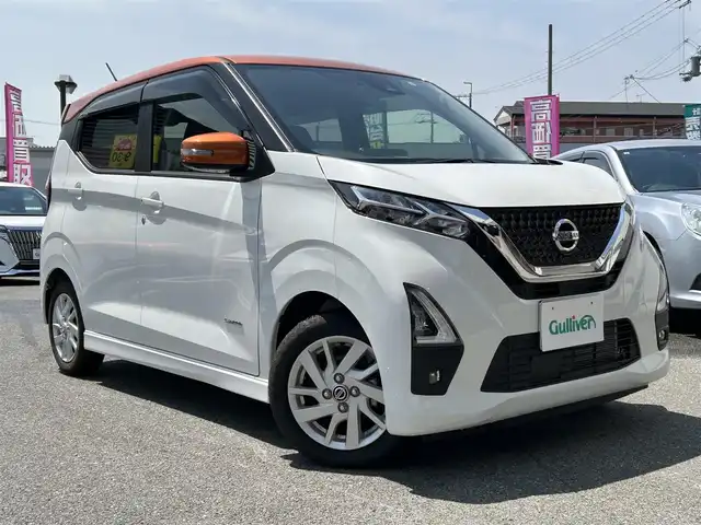 日産 デイズ ハイウェイスターX 奈良県 2022(令4)年 0.2万km プレミアムサンシャインオレンジメタリック/シルキーホワイト 純正9インチナビ/(BT/DVD/CD)/フルセグTV/ミラー型全方位カメラ/ナビ連動ドラレコ/エマージェンシーブレーキ/車線逸脱警報/標識認識/ETC2.0/革巻きステアリング/純正14インチAW/LEDオートライト/フォグライト/電格ミラー