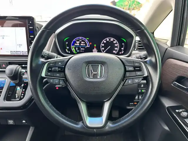 ホンダ オデッセイ ハイブリッド e:HEVアブソルート 宮城県 2021(令3)年 6.9万km プレミアムヴィーナスブラックP ホンダセンシング/・衝突軽減ブレーキ/・歩行者事故低減ステアリング/・アダプティブクルーズコントロール/・車線維持支援システム/・路外逸脱抑制機能/・誤発進抑制機能/・先行車発進お知らせ機能/・標識認識機能/・後方誤発進抑制機能/パーキングセンサーシステム/スマートパーキングアシストシステム/マルチビューカメラシステム/フリップダウンモニター（TVM-FW1300）/純正10インチナビ（VXU-217DYi）/・CD/DVD/・Bluetooth/・フルセグTV/ビルトインETC2.0/ドライブレコーダー/ハーフレザーシート/ジェスチャーコントロールパワースライドドア（運転席側/助手席側）/運転席パワーシート/2列目プレミアムクレードルシート/革巻きステアリング/ステリングスイッチ/電動パーキングブレーキ/ブレーキホールド/LEDヘッドランプ/フォグランプ/オートライト/スマートキー＆プッシュスタート/スペアキー1本/電動格納ミラー/純正17インチAW/純正フロアマット/W/サイド/カーテンエアバッグ