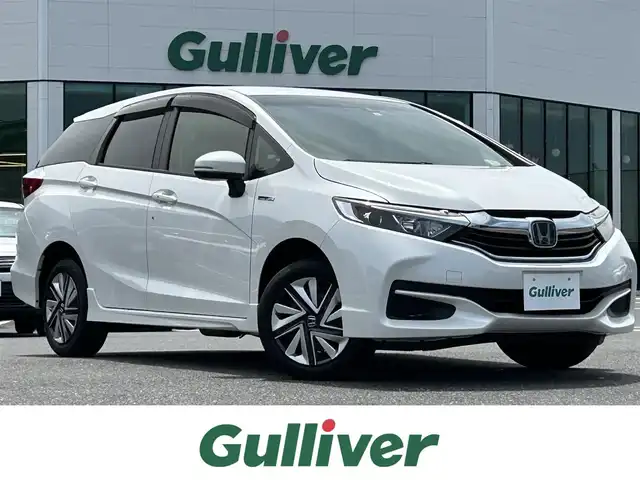 ホンダ シャトル ハイブリッド ホンダセンシング 島根県 2019(平31)年 8.5万km プラチナホワイトパール 4WD/社外ナビ/CD/ワンセグTV/レーダークルーズコントロール/スマートキー/スペアキー /プッシュスタート/ホイール付きスタッドレス積込/フロアマット/ドアバイザー/ドライブレコーダー/ETC/電動格納ミラー/レーンキープ/Fワイパーデアイサー