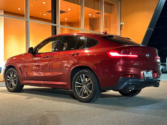 ＢＭＷ Ｘ４ xDrive 30i Mスポーツ 岐阜県 2019(令1)年 3.2万km 赤 ワンオーナー/アダプティブLEDヘッドライト/BMWヘッドアップディスプレイ/BMWライブ・コックピット/　マルチディスプレイメーターパネル/　HDDナビゲーションシステム/　電動フロントシート運転席助手席　運転席メモリー機能付/　フロントシートヒーティング/　リヤシートヒーティング/パーキングアシストプラス/　パーク・ディスタンス・コントロール/　パーキング・アシスト/　トップ・ビュー3Dビュー/　サイドビューカメラ/　リヤビューカメラ予想進路表示機能付/ドライビングアシストプラス/　アクティブクルーズコントロール　ストップゴー機能付/　ステアリング　レーンコントロールアシスト/　レーンディパーチャーウォーニング/　レーンチェンジウォーニング/　アクティブサイドコリジョンプロテクション/　前車接近警告機能/　衝突回避　被害軽減ブレーキ/　事故回避アシスト/　後車衝突警告機能/　クロストラフィックウォーニング